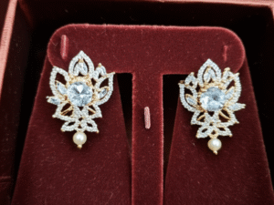 52.Elegant White Gold Plated Floral Earrings with American Diamonds & white stone with blue tint drop Glass Stones – Statement Studs for Special Occasions